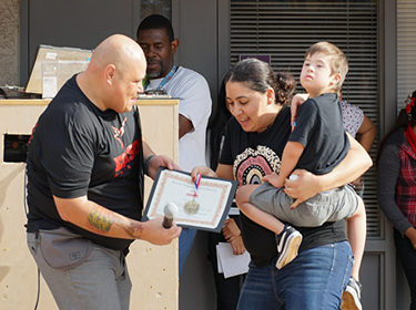  Edison Principal Joseph Fuentes awarding Students
