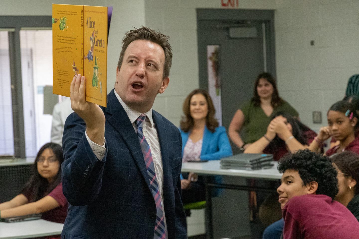Maricopa County School Superintendent Steve Watson reading Alice and Greta by Steven J. Simmons to Ms. McEvoy's 7th-grade class at Garfield Elementary School.