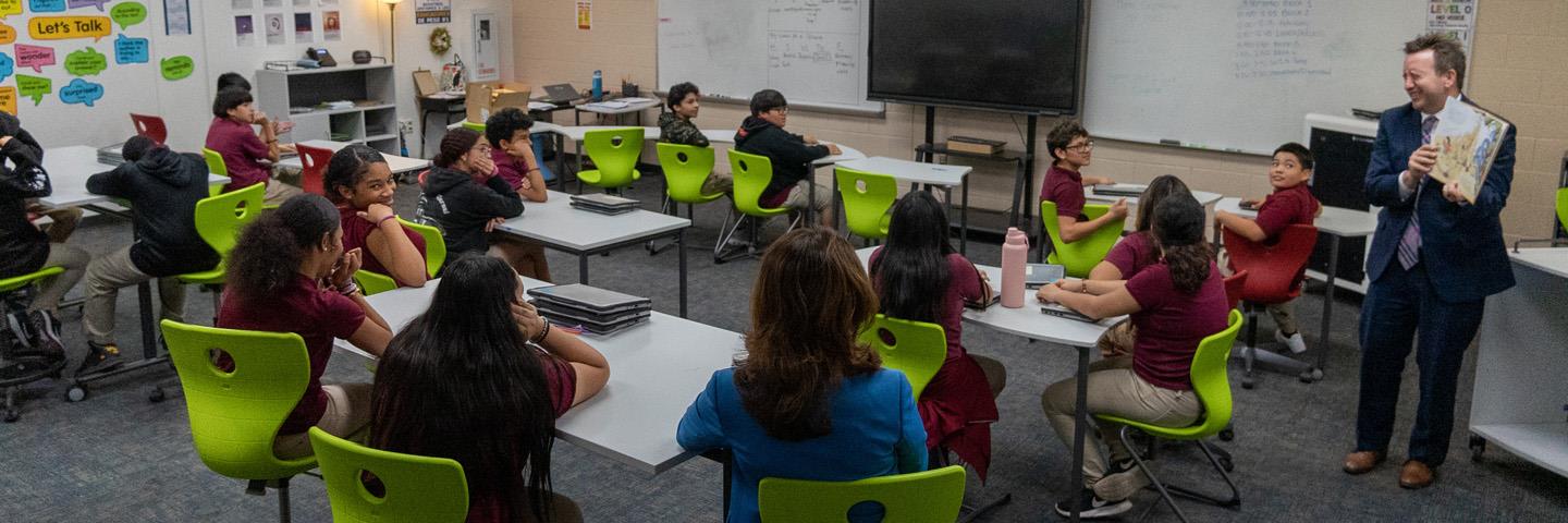 Maricopa County School Superintendent Steve Watson reading Alice and Greta by Steven J. Simmons to Ms. McEvoy's 7th-grade class at Garfield Elementary School.