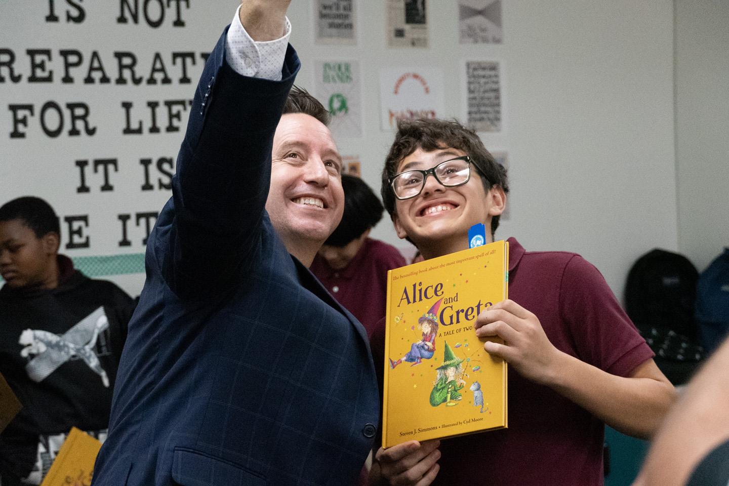 Maricopa County School Superintendent Steve Watson reading Alice and Greta by Steven J. Simmons to Ms. McEvoy's 7th-grade class at Garfield Elementary School.
