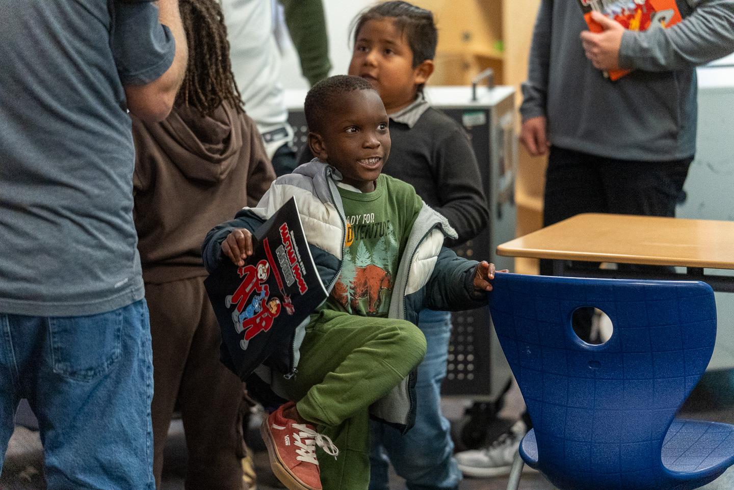 When he tried to return his new hat, thinking it was borrowed, Mr. Carroll reassured him, “That’s a gift. That’s your hat now!” His smile couldn’t have been bigger.