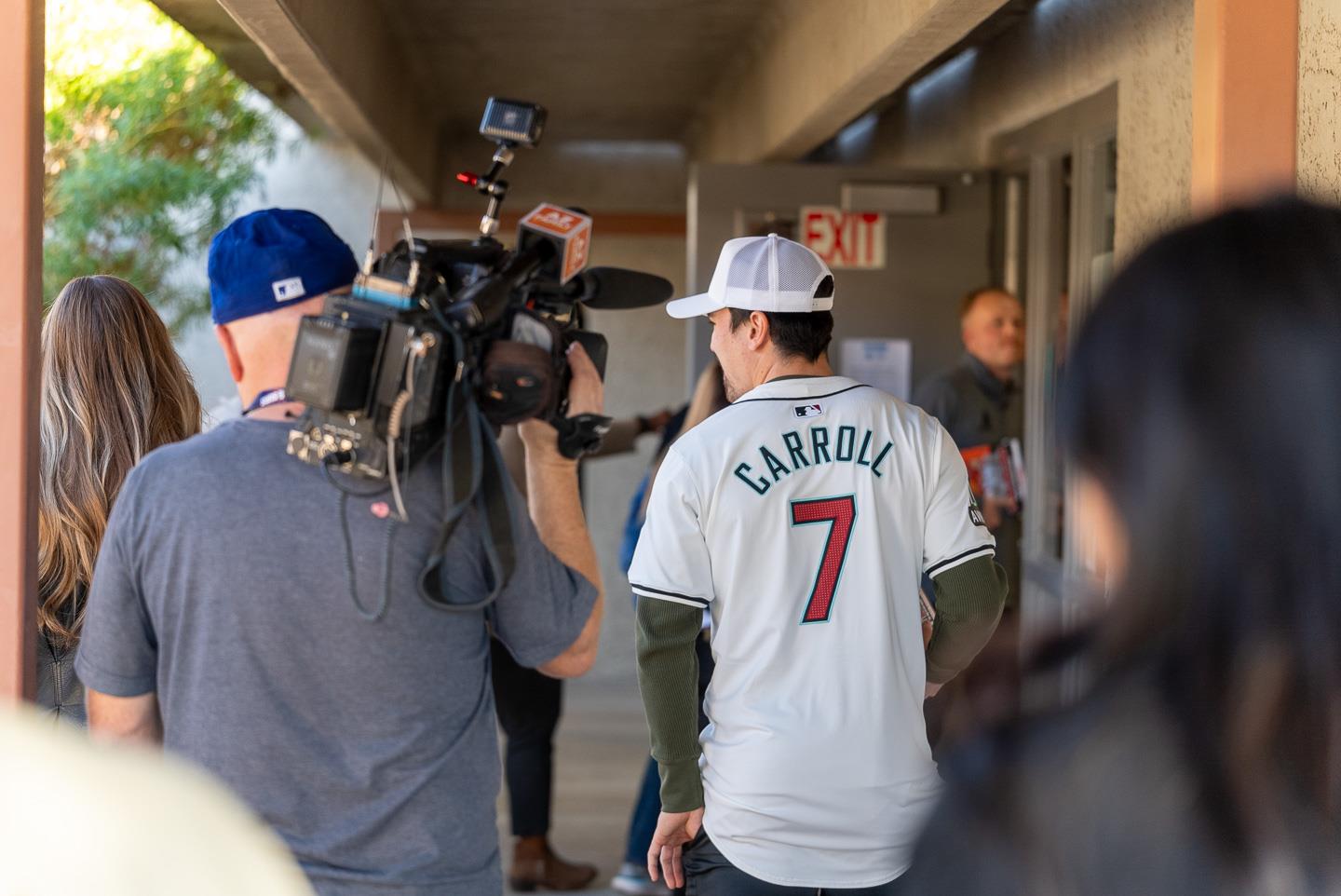 Carroll and his team head into a classroom, about to surprise the students!