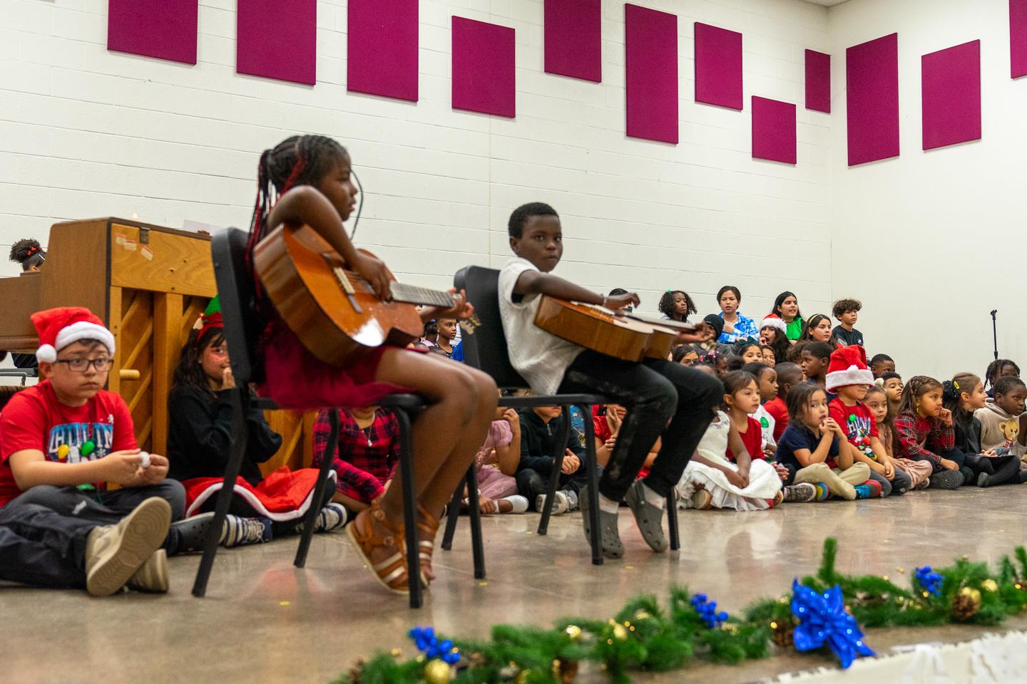 Two students showcased their talent with a beautiful acoustic guitar duet, filling the room with melody and applause!